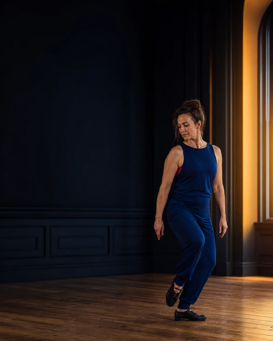 Adult Sean-nós dancer practising in a contemporary studio