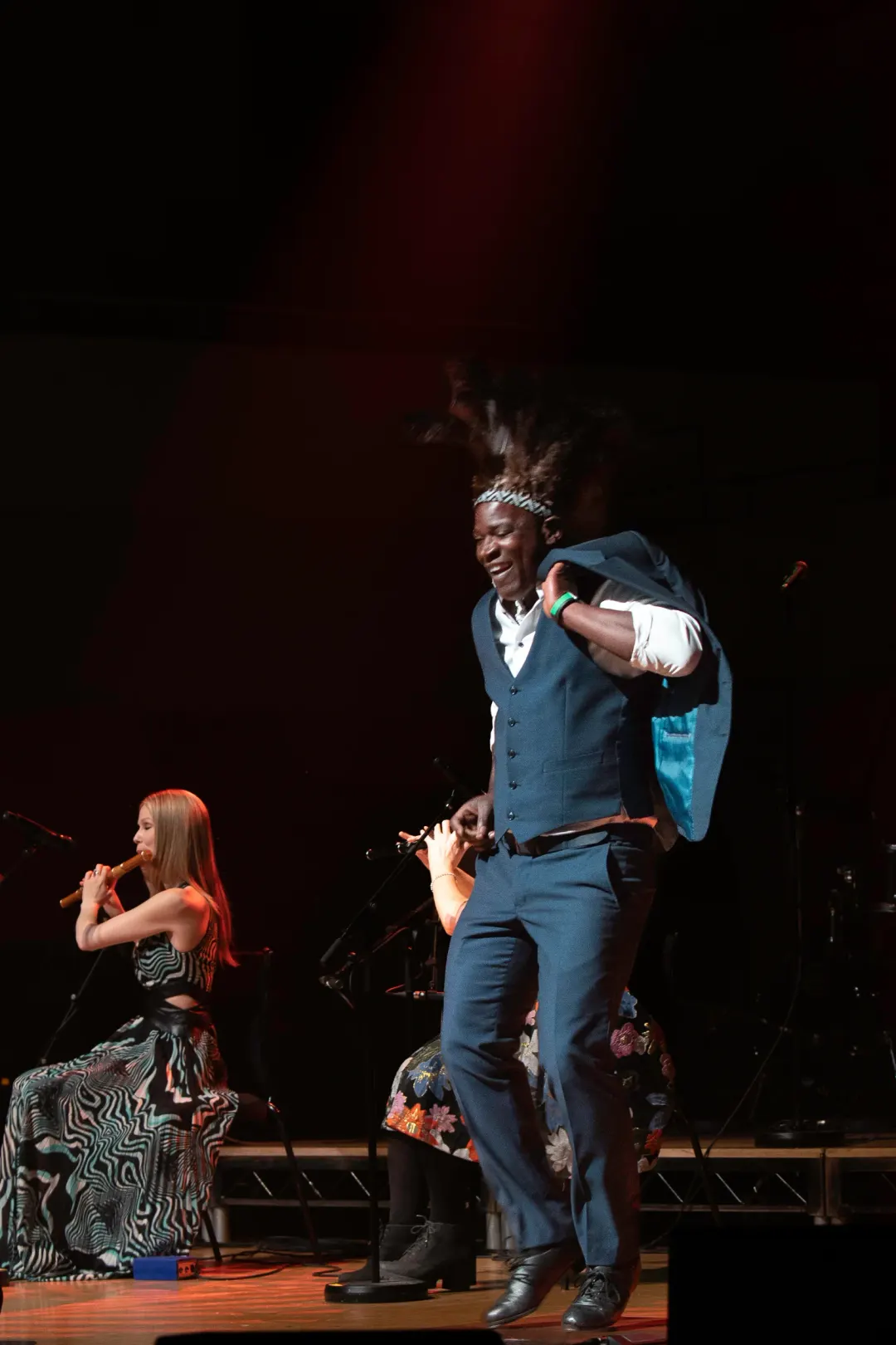 Tura Arutura dancing on stage with live musicians